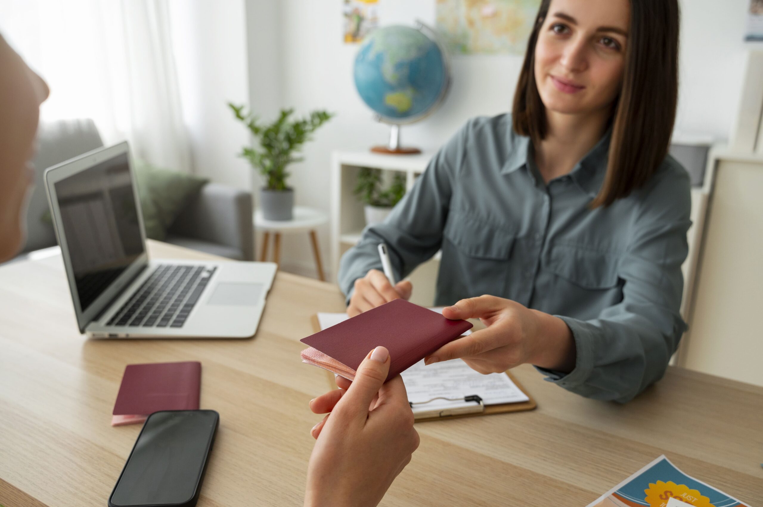 high-angle-woman-working-as-travel-agent-min